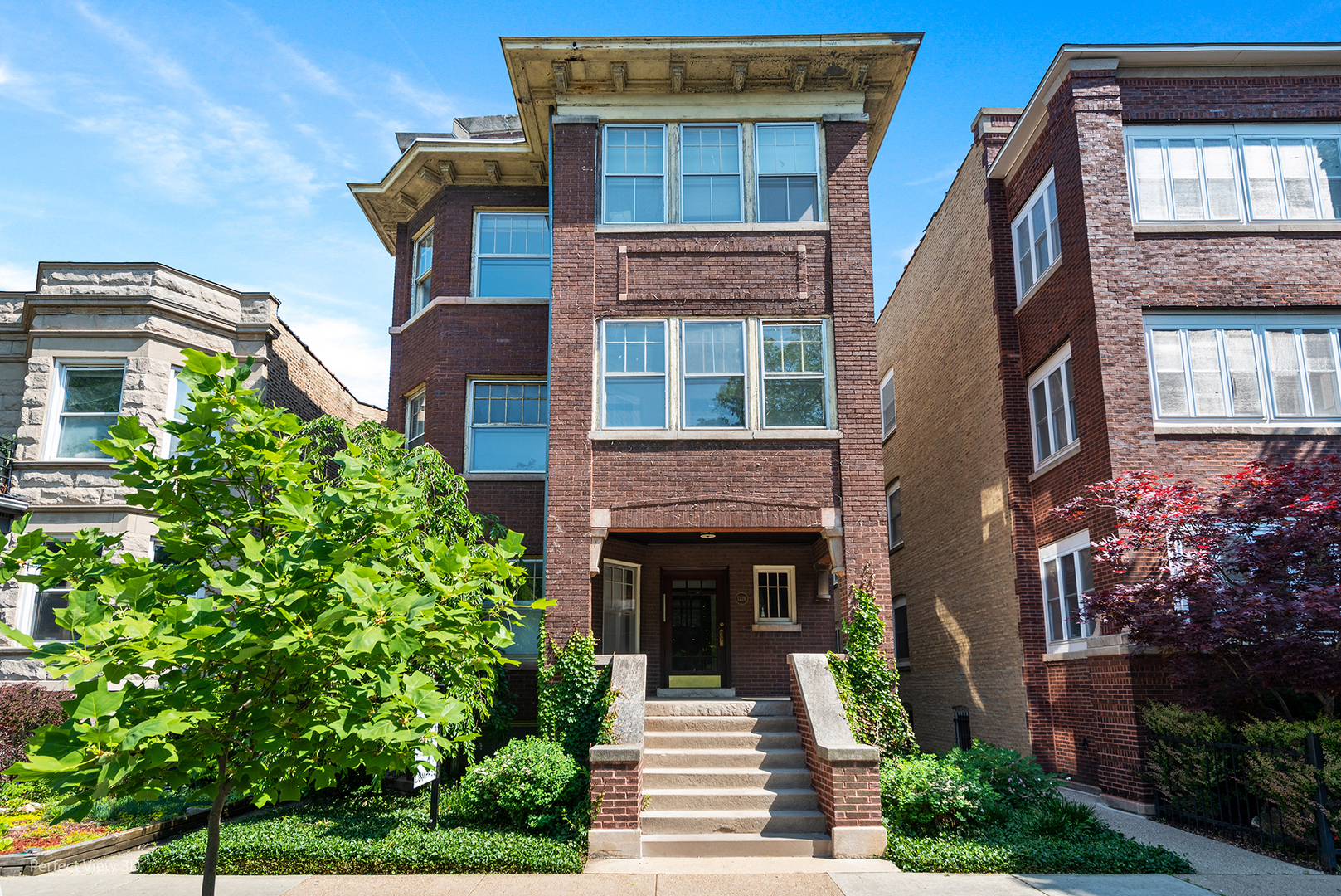 1228 West Elmdale Avenue Chicago, IL 60660 - Photo 1 of 43 a front view of a house