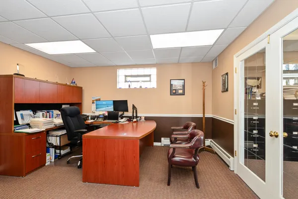 a view of a workspace with furniture