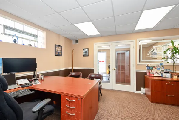 a bedroom with sink and bed