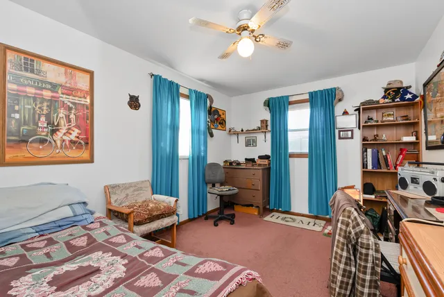 a bathroom with a toilet a sink and a shower