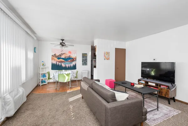 a bedroom with a bed and a table in it