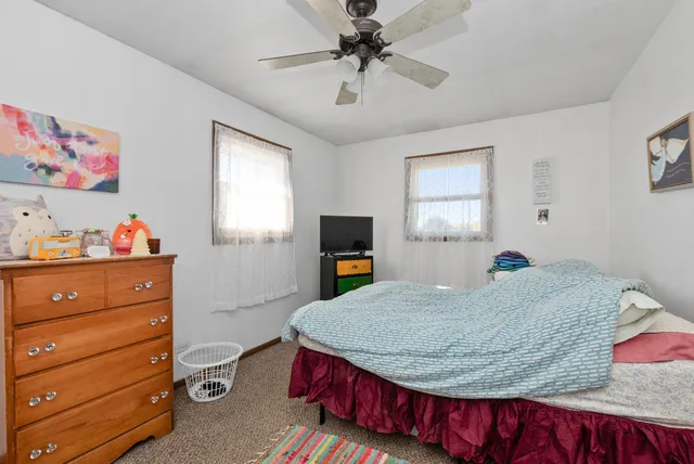a bathroom with a sink toilet vanity and tub