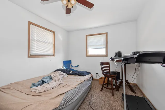 a bathroom with a sink toilet vanity and bathtub