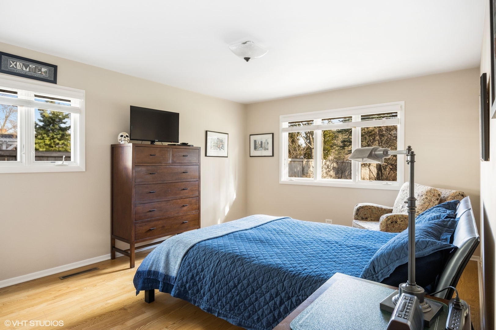 920 Pine Tree Lane Winnetka, IL 60093 - Photo 31 of 59 a bedroom with a bed and wooden floor