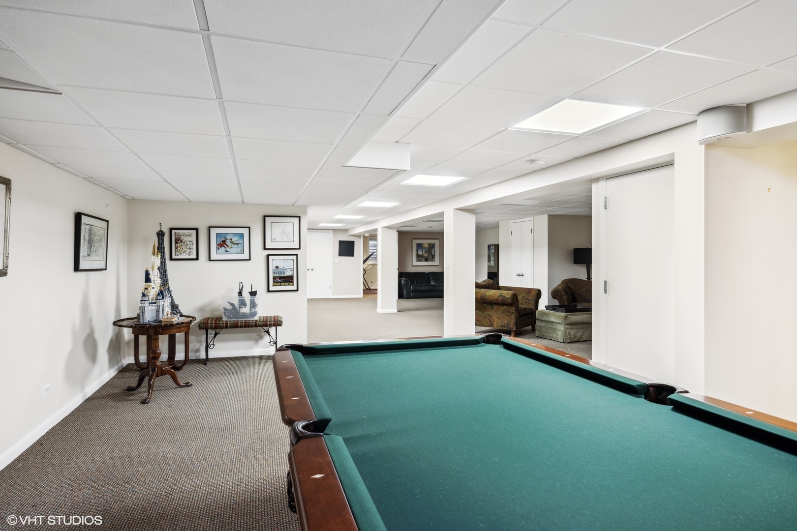920 Pine Tree Lane Winnetka, IL 60093 - Photo 38 of 59 a living room with furniture and a dining table with kitchen view
