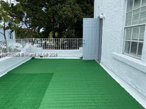 2633 Southwest 34th Avenue Miami, FL 33133 - Photo 14 of 16 a view of a chair and table in the backyard