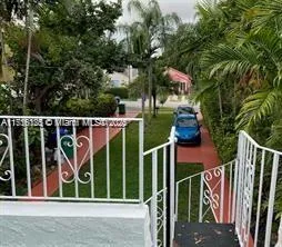 a view of a house with backyard and deck