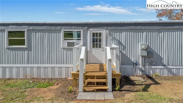 a front view of a house with stairs