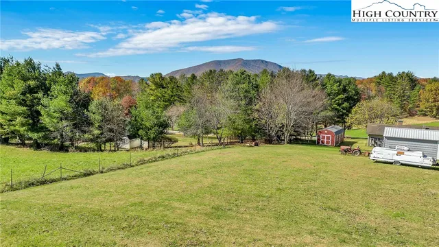 a view of a field with an trees