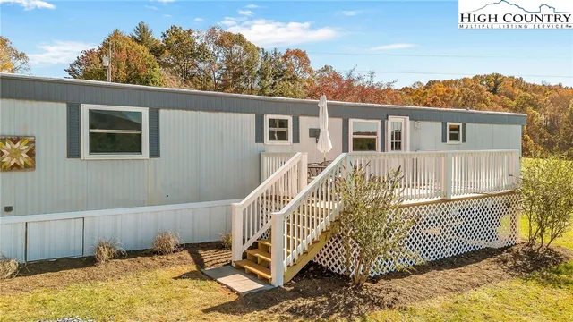 a view of a house with a wooden deck