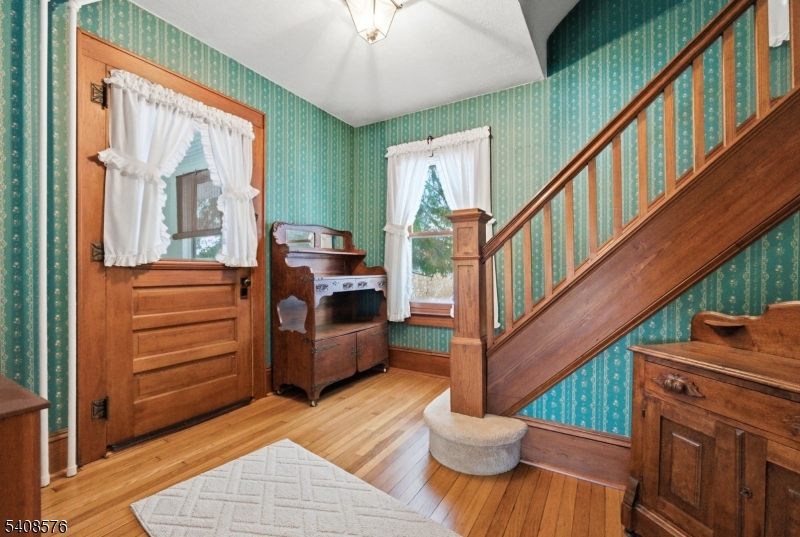 203 Johnsonburg Road Andover, NJ 07821 - Photo 13 of 42 a view of an entryway with wooden floor and stairs