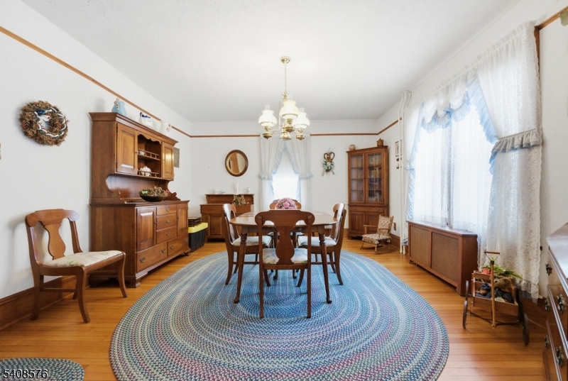 203 Johnsonburg Road Andover, NJ 07821 - Photo 20 of 42 a view of a dining room with furniture window and wooden floor