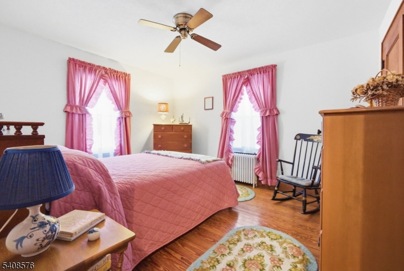 203 Johnsonburg Road Andover, NJ 07821 - Photo 30 of 42 a bed room with a bed and a chair