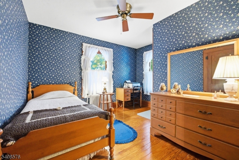 203 Johnsonburg Road Andover, NJ 07821 - Photo 33 of 42 a bedroom with a bed and balcony view