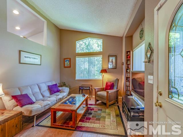 7551 Devonshire Lane Reno, NV 89511 - Photo 4 of 23 a living room with furniture and a window