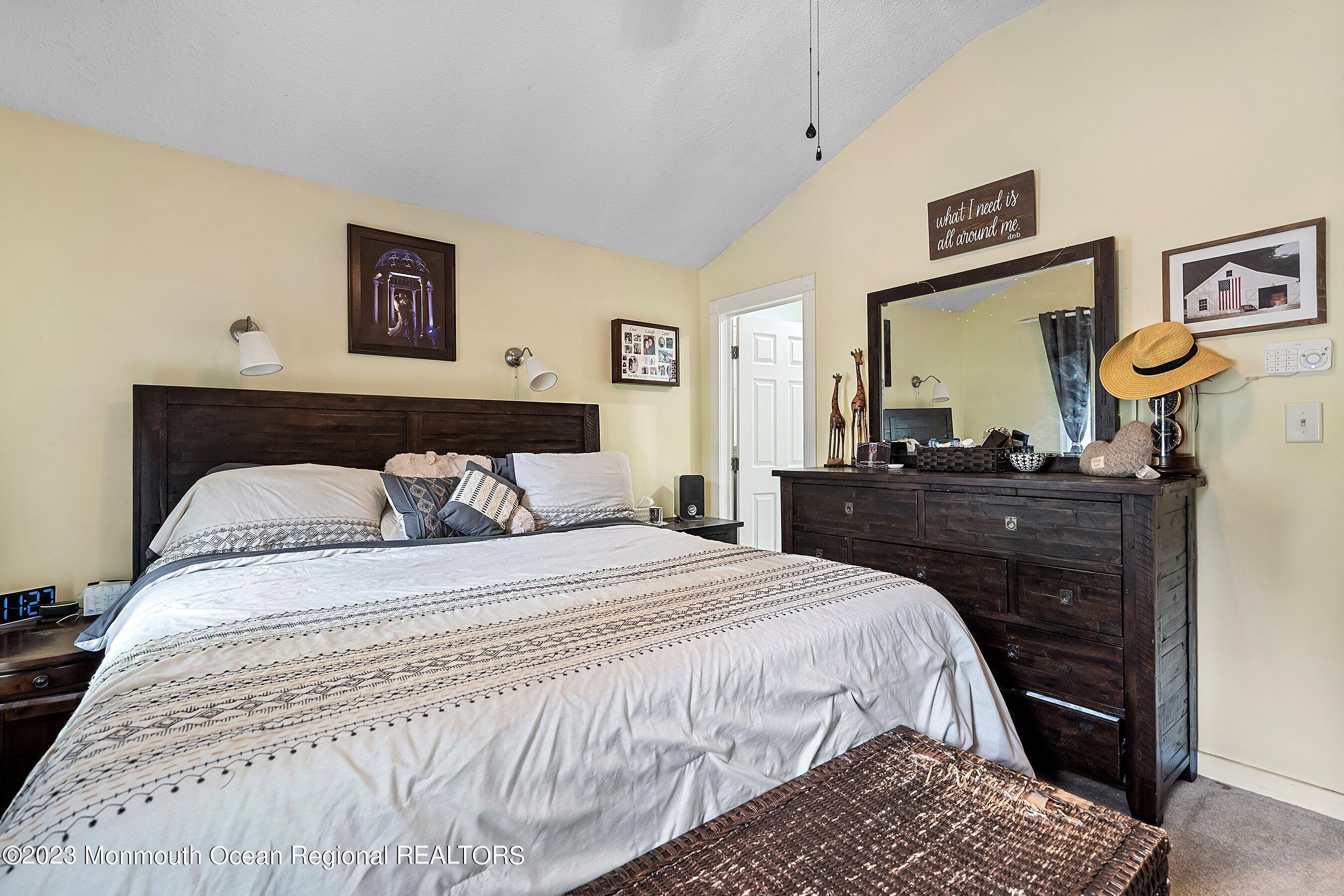 17 Murdock Place Jackson, NJ 08527 - Photo 19 of 34 a bedroom with a bed and painting on the wall