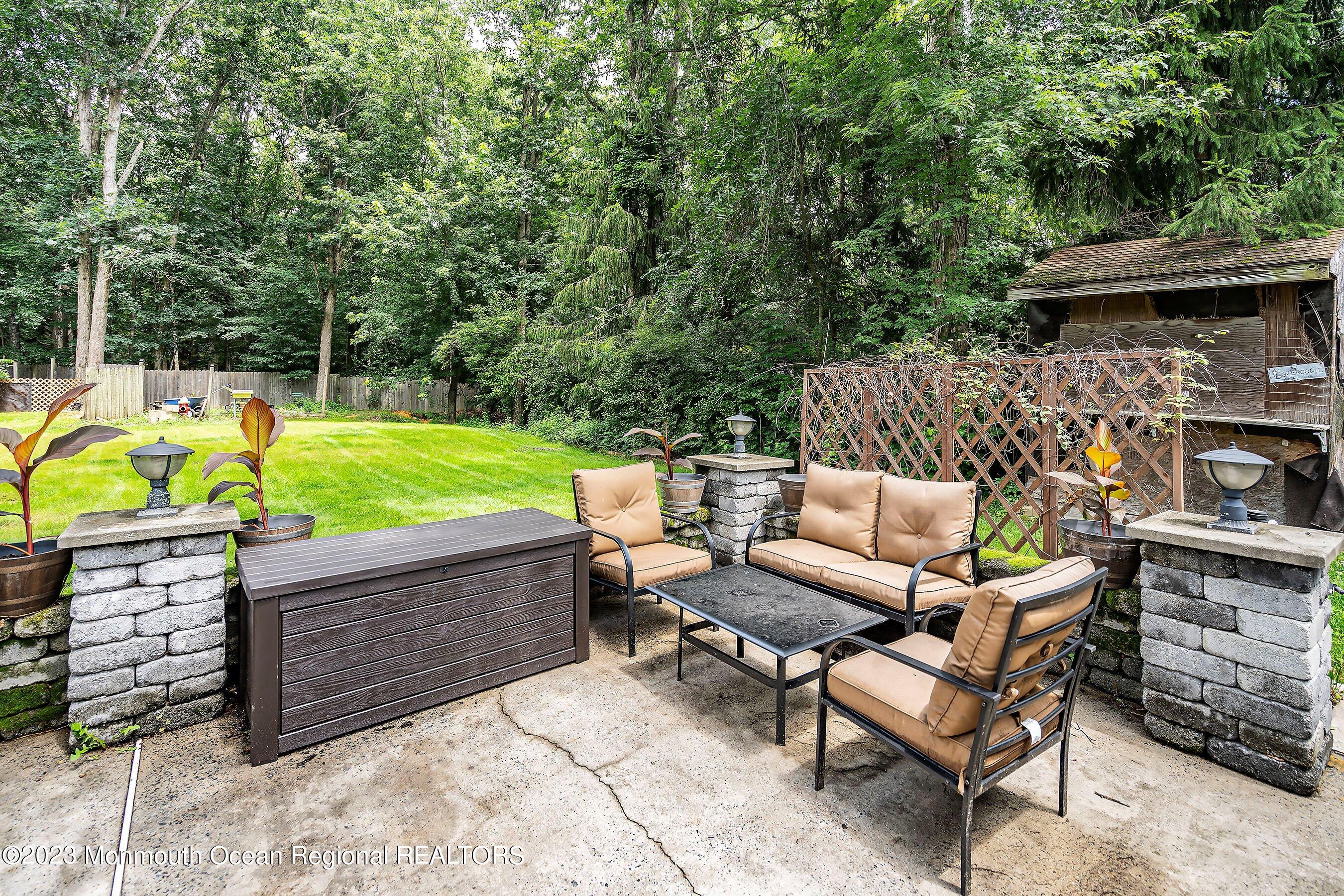 17 Murdock Place Jackson, NJ 08527 - Photo 25 of 34 a view of a backyard with chairs and a tub