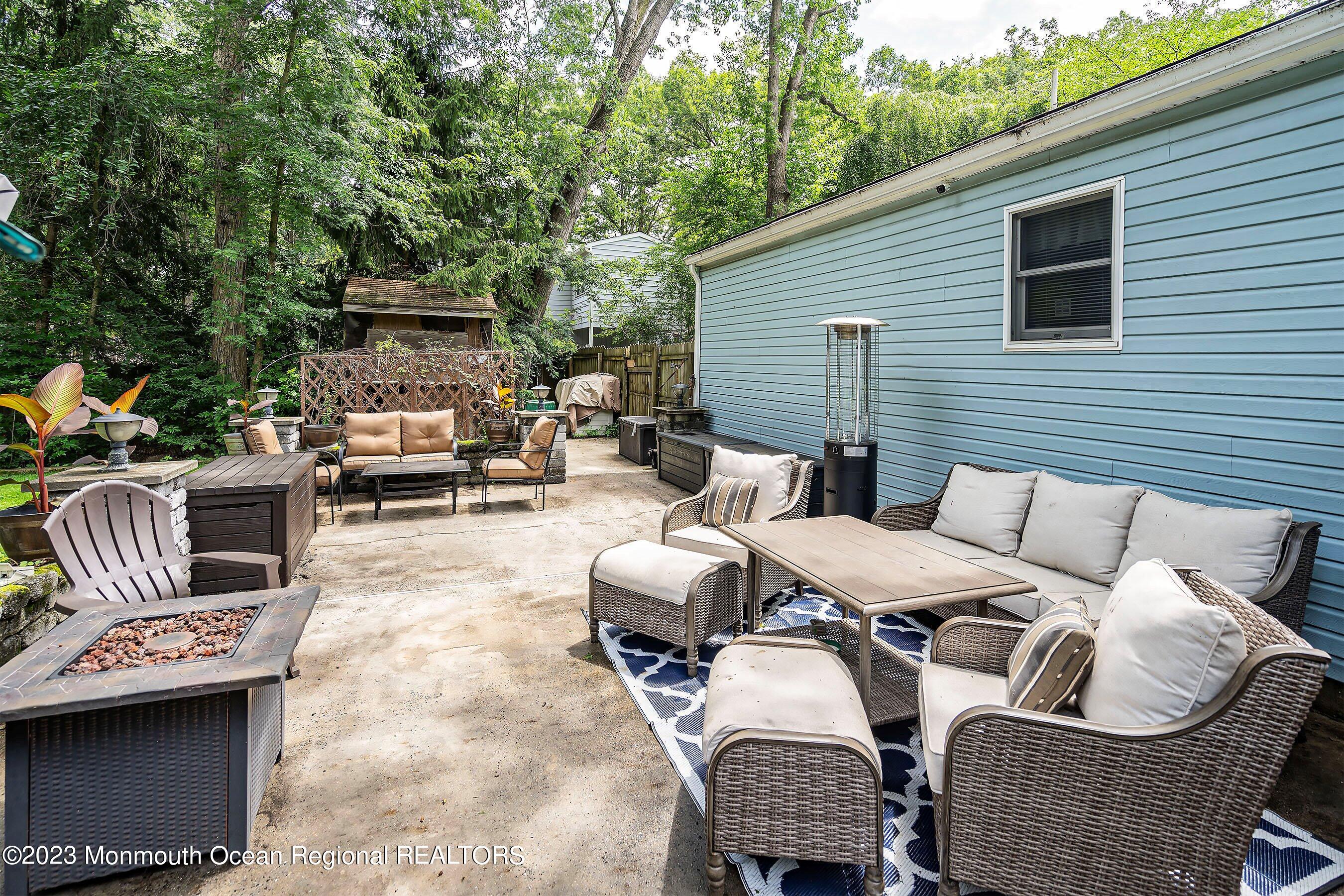 17 Murdock Place Jackson, NJ 08527 - Photo 26 of 34 a patio with patio a couch and chairs