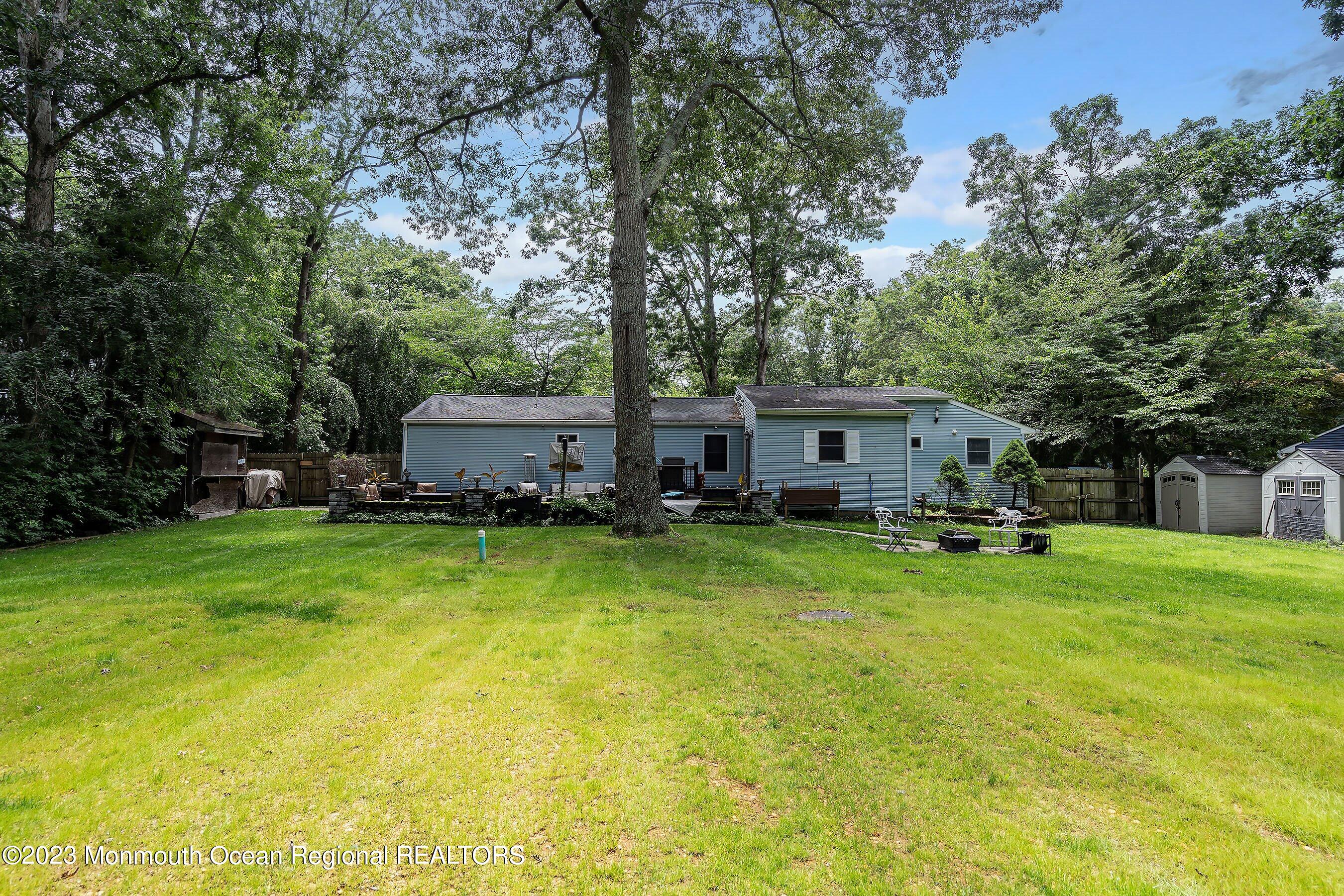 17 Murdock Place Jackson, NJ 08527 - Photo 27 of 34 a view of a house with a big yard and large trees