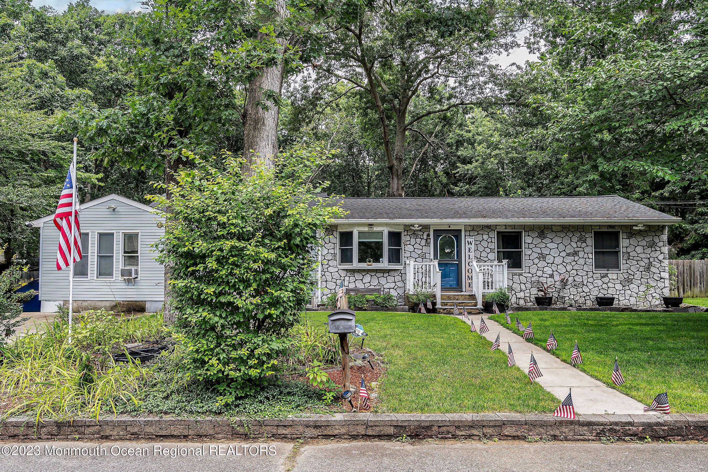 17 Murdock Place Jackson, NJ 08527 - Photo 6 of 34 a front view of a house with a yard