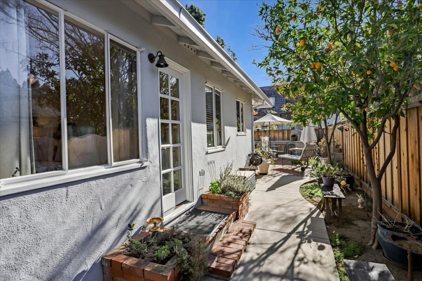 1130 Castro Street Mountain View, CA 94040 - Photo 28 of 37 a view of a house with backyard sitting area and garden