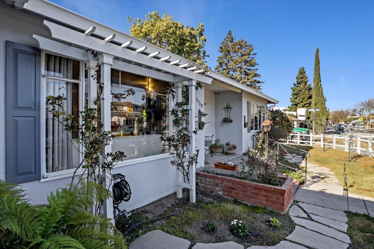 1130 Castro Street Mountain View, CA 94040 - Photo 4 of 37 a front view of a house with a garden