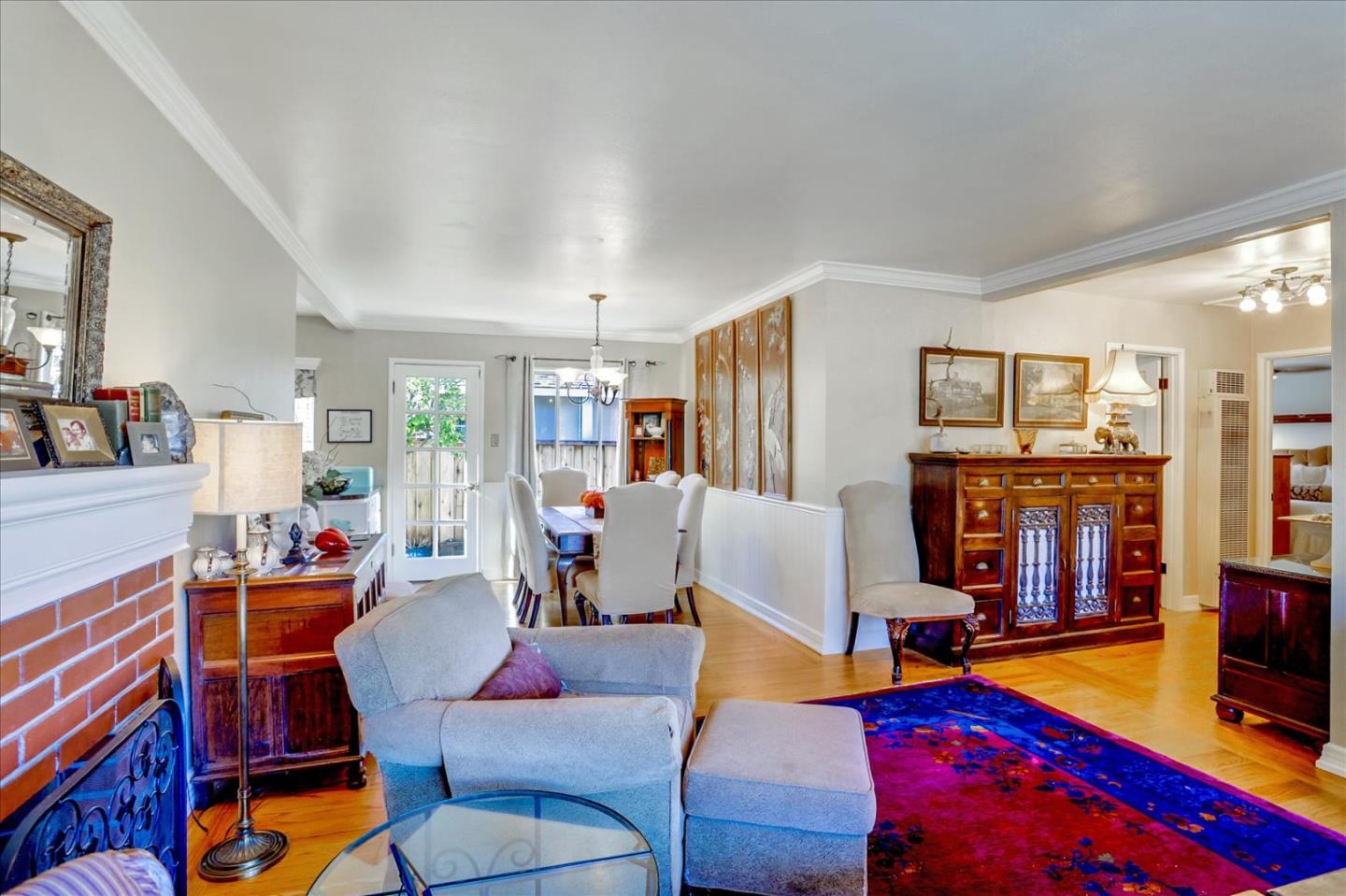 1130 Castro Street Mountain View, CA 94040 - Photo 8 of 37 a living room with patio furniture and a flat screen tv