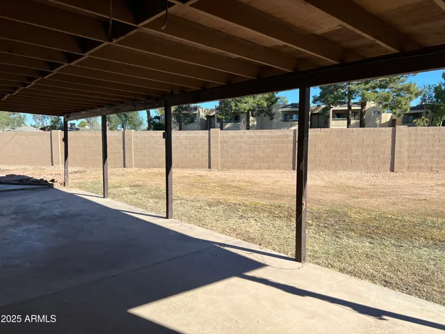 a view of a backyard of the house
