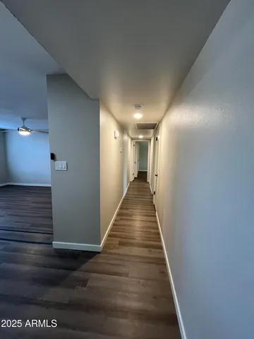 a view of gallery with wooden floor