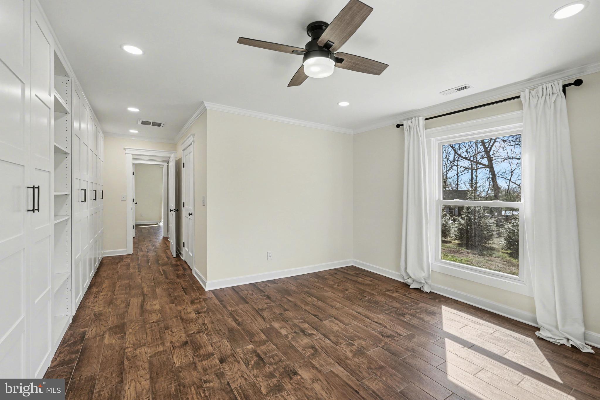 11080 Dutch Hollow Road Culpeper, VA 22701 - Photo 11 of 28 a view of hallway with a ceiling fan and window