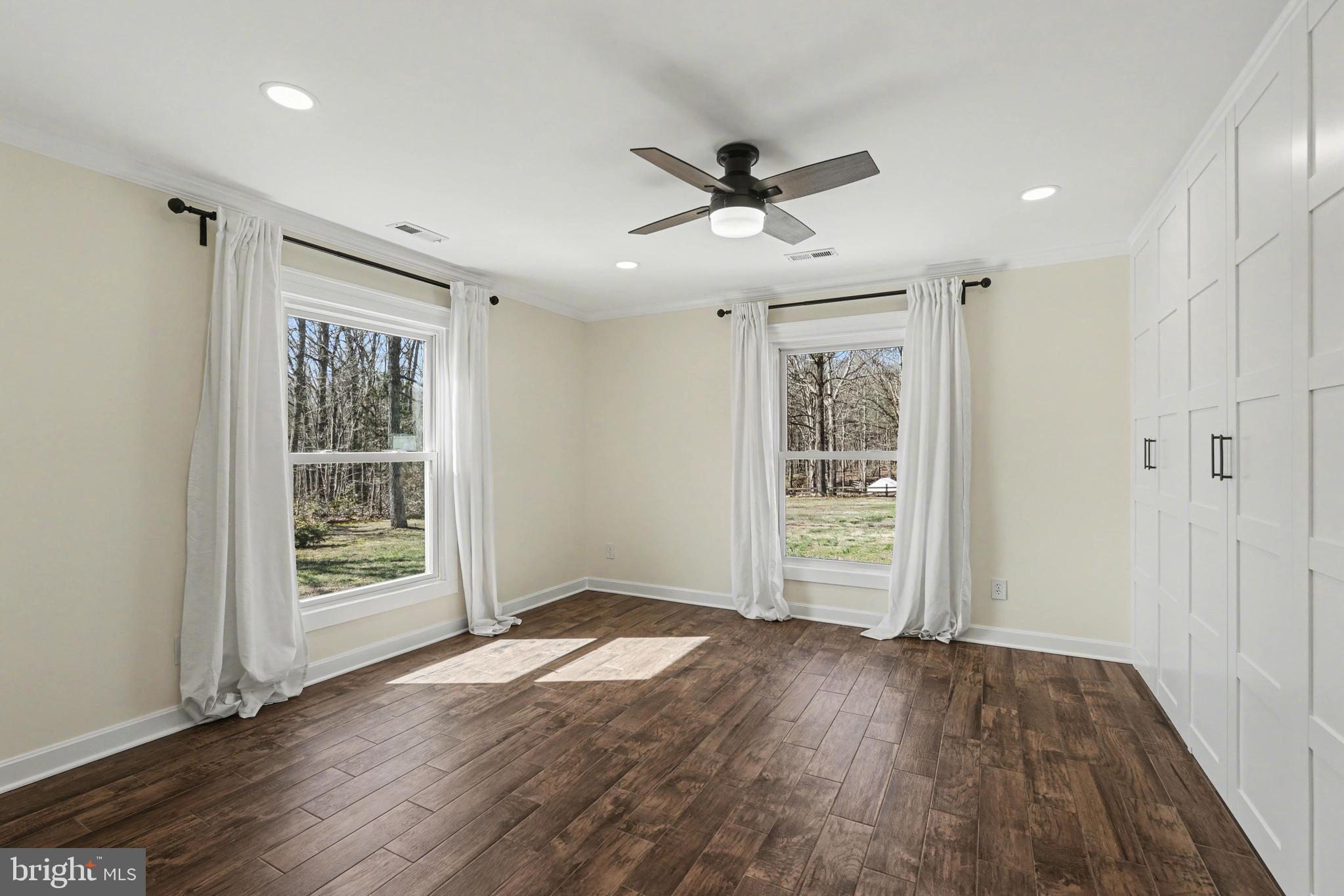 11080 Dutch Hollow Road Culpeper, VA 22701 - Photo 12 of 28 a view of empty room with wooden floor and fan