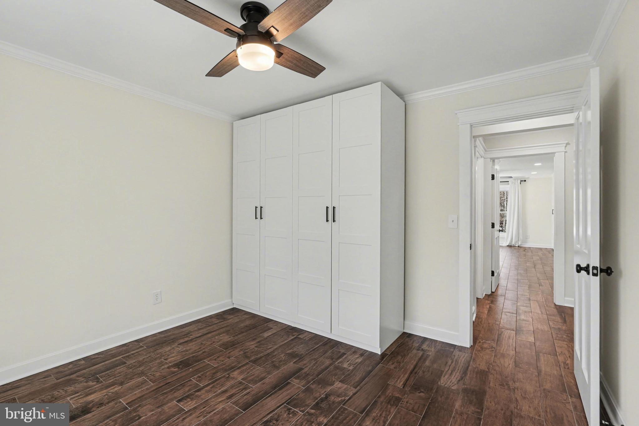 11080 Dutch Hollow Road Culpeper, VA 22701 - Photo 24 of 28 a view of a hallway with wooden floor and closet area