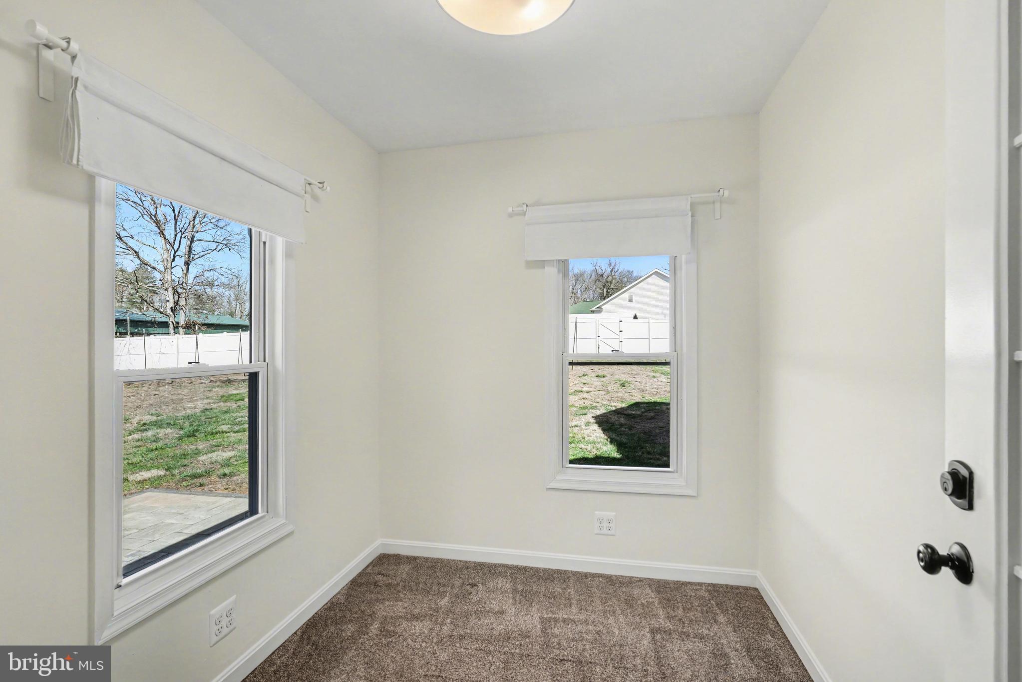 11080 Dutch Hollow Road Culpeper, VA 22701 - Photo 25 of 28 an empty room with windows and closet