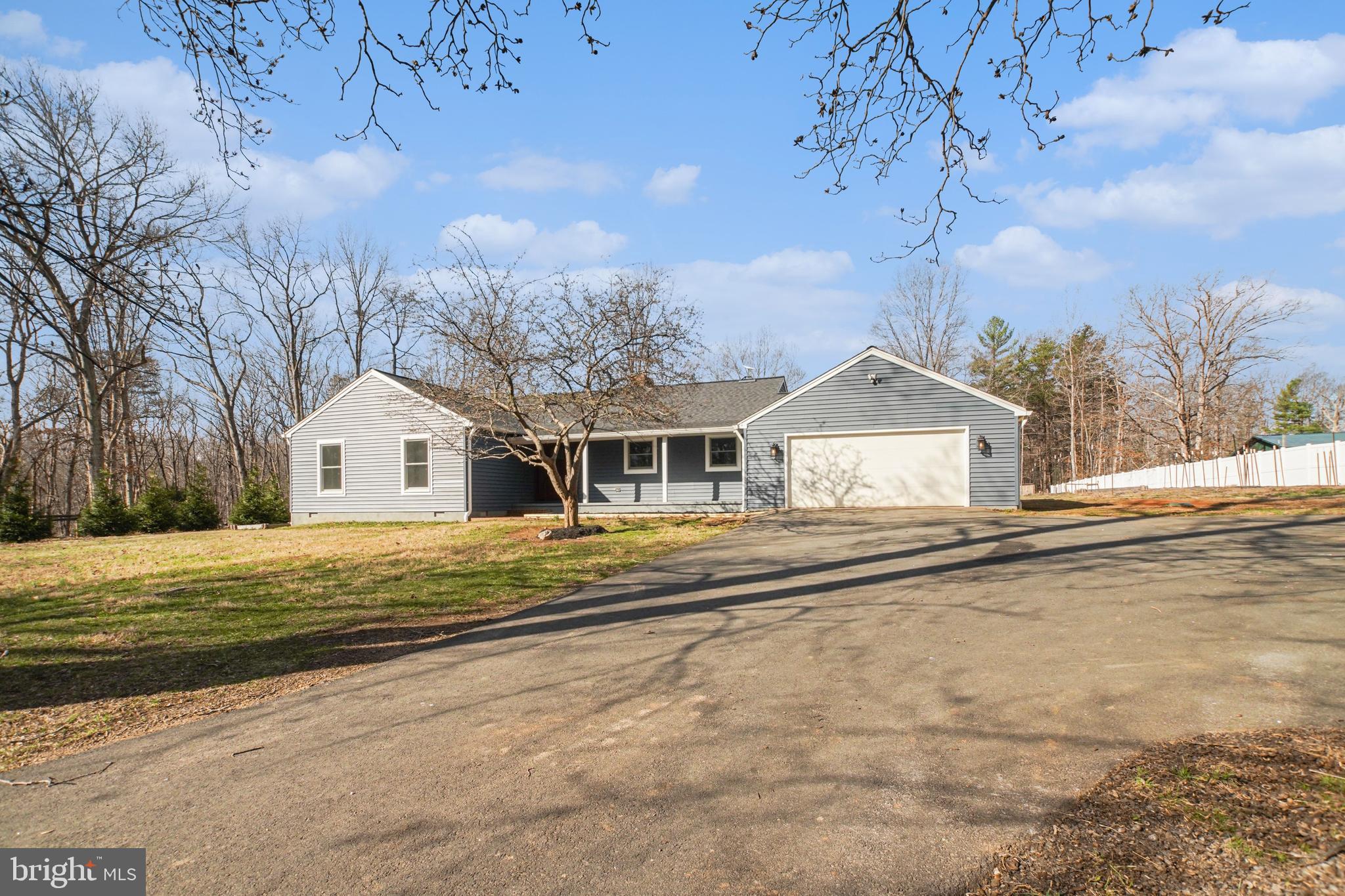 11080 Dutch Hollow Road Culpeper, VA 22701 - Photo 26 of 28 a front view of a house with a yard