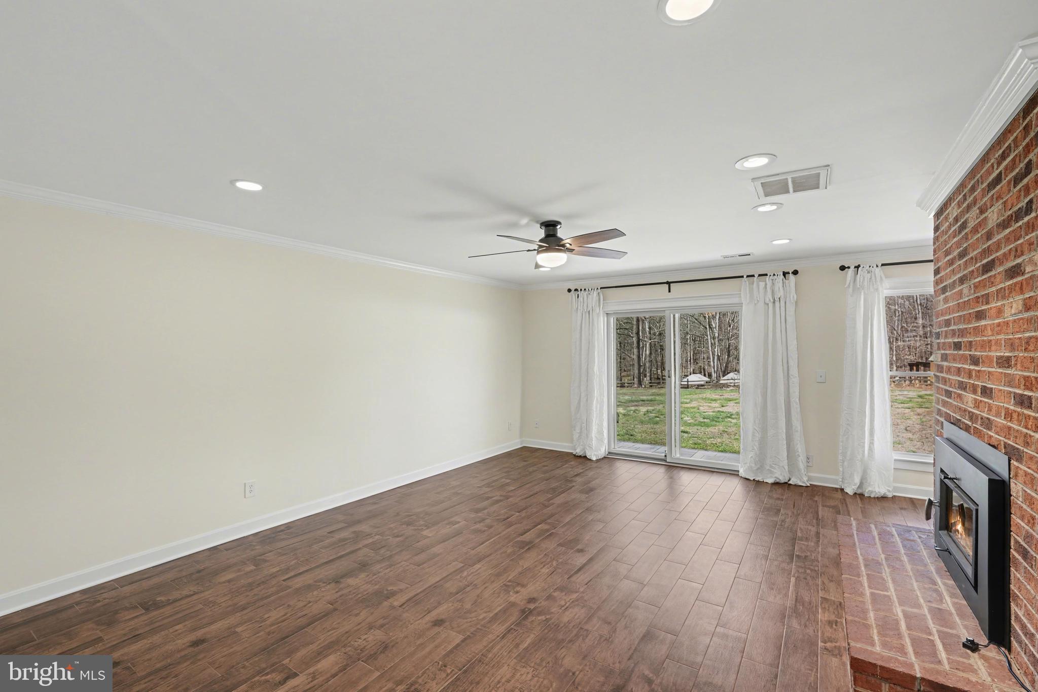 11080 Dutch Hollow Road Culpeper, VA 22701 - Photo 7 of 28 wooden floor in an empty room with a window