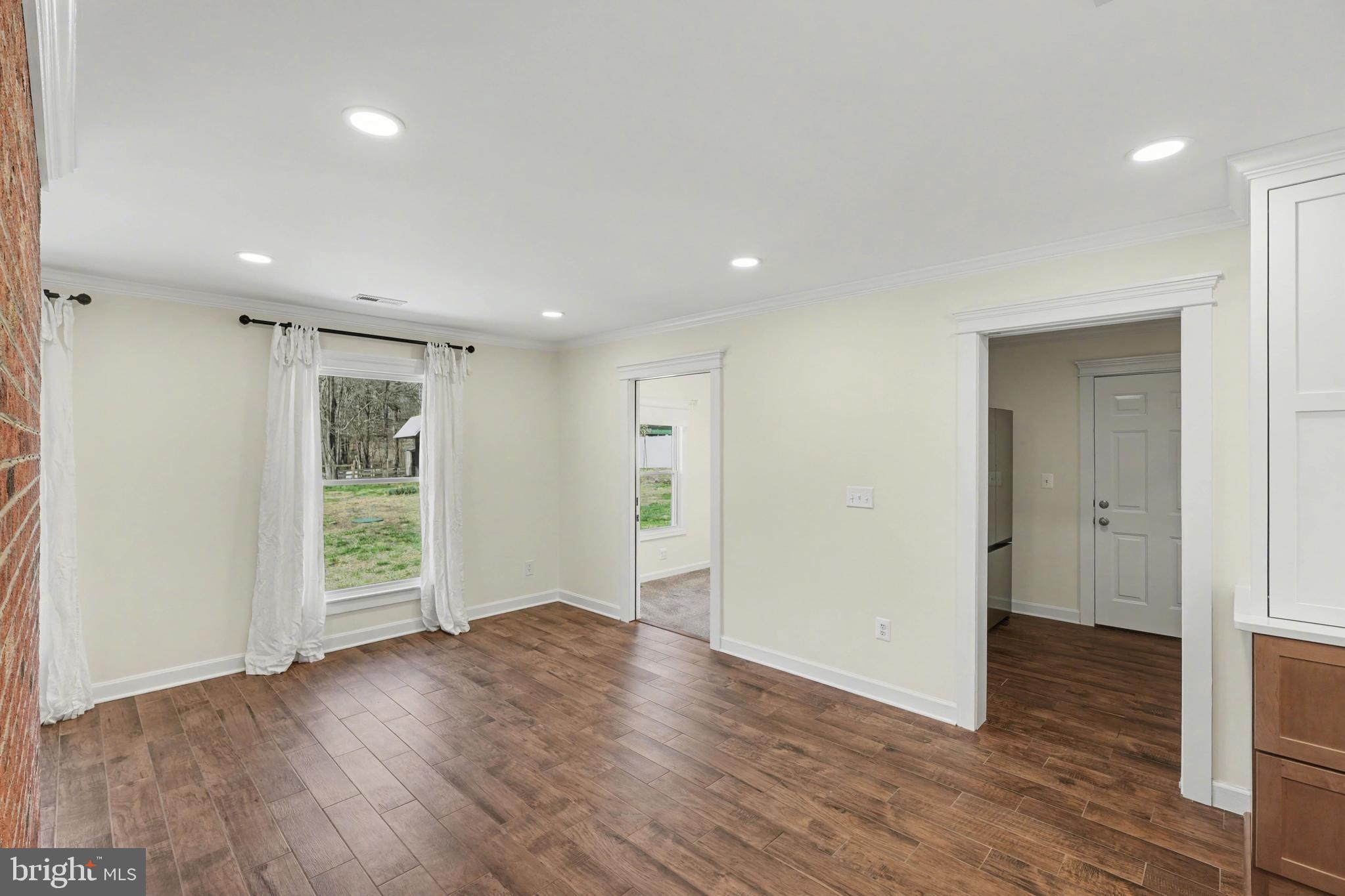 11080 Dutch Hollow Road Culpeper, VA 22701 - Photo 9 of 28 a view of an empty room with wooden floor and closet
