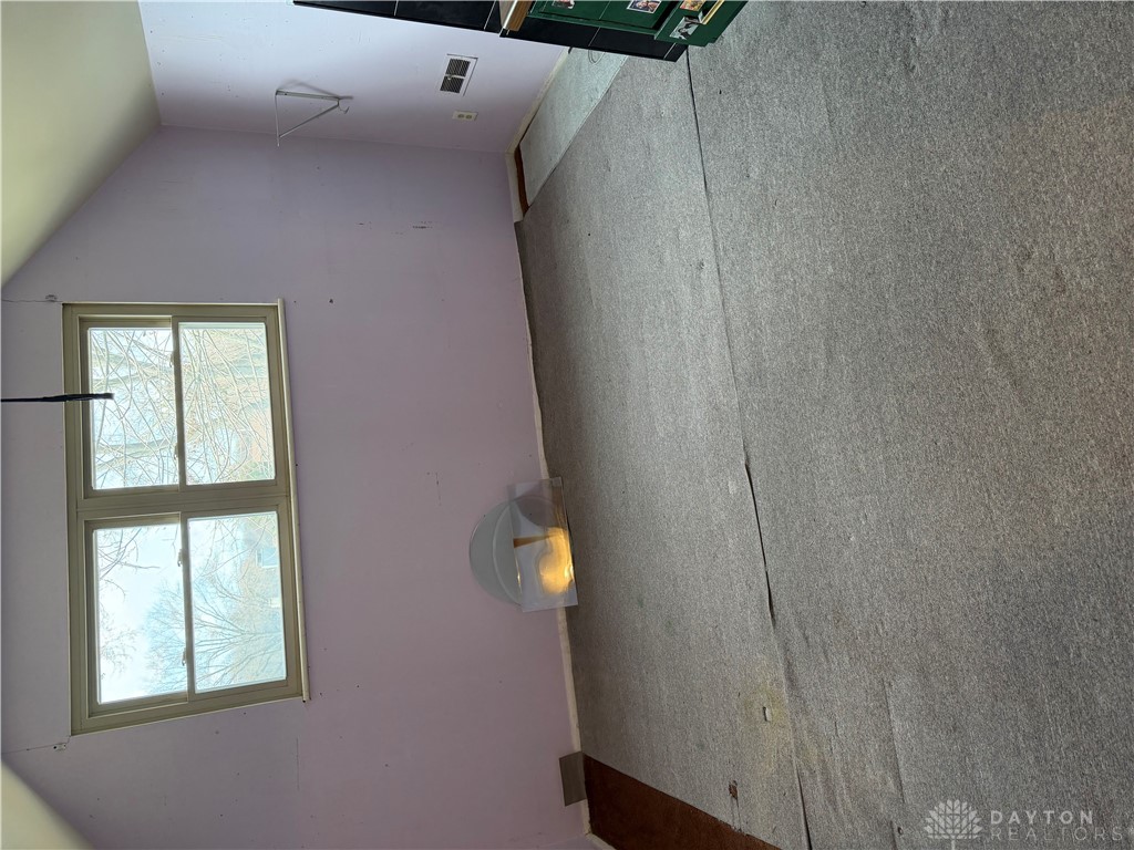 4867 Rittenhouse Drive Dayton, OH 45424 - Photo 2 of 17 This spacious room offers ample natural light and a classic aesthetic.