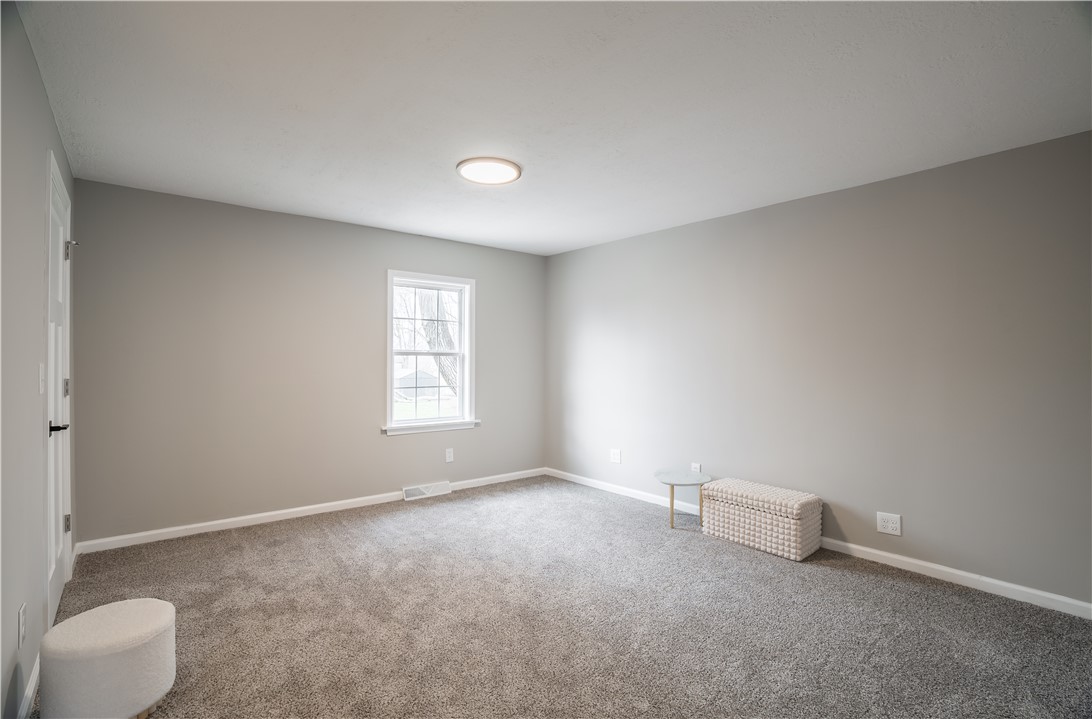 8240 Looney Road Piqua, OH 45356 - Photo 18 of 49 This bright and airy room offers a comfortable and inviting atmosphere for relaxation and rejuvenation.