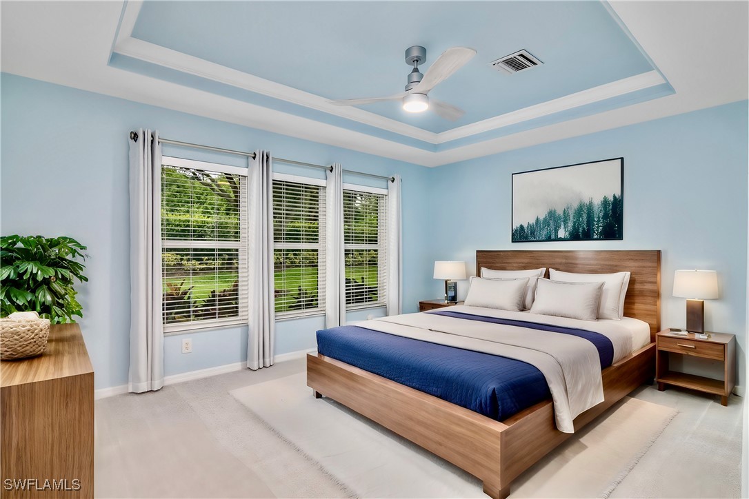19642 Villa Rosa Loop Estero, FL 33967 - Photo 12 of 27 a spacious bedroom with a large bed and a window