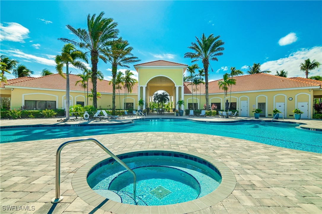 19642 Villa Rosa Loop Estero, FL 33967 - Photo 22 of 27 a swimming pool with outdoor seating and yard
