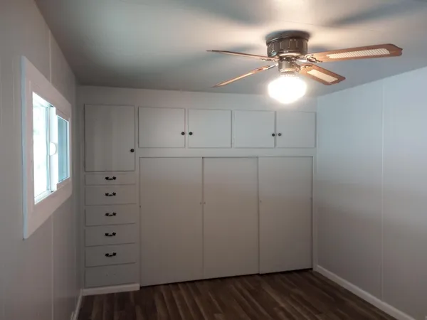 a view of cabinets and wooden floor