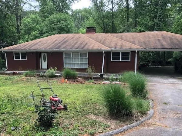 a view of a house with garden and plants