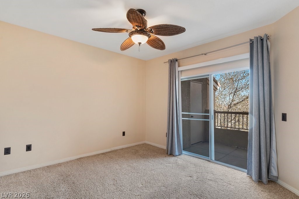 10001 Peace Way, Unit 2311 Las Vegas, NV 89147 - Photo 15 of 35 Spare room featuring light carpet and a ceiling fan