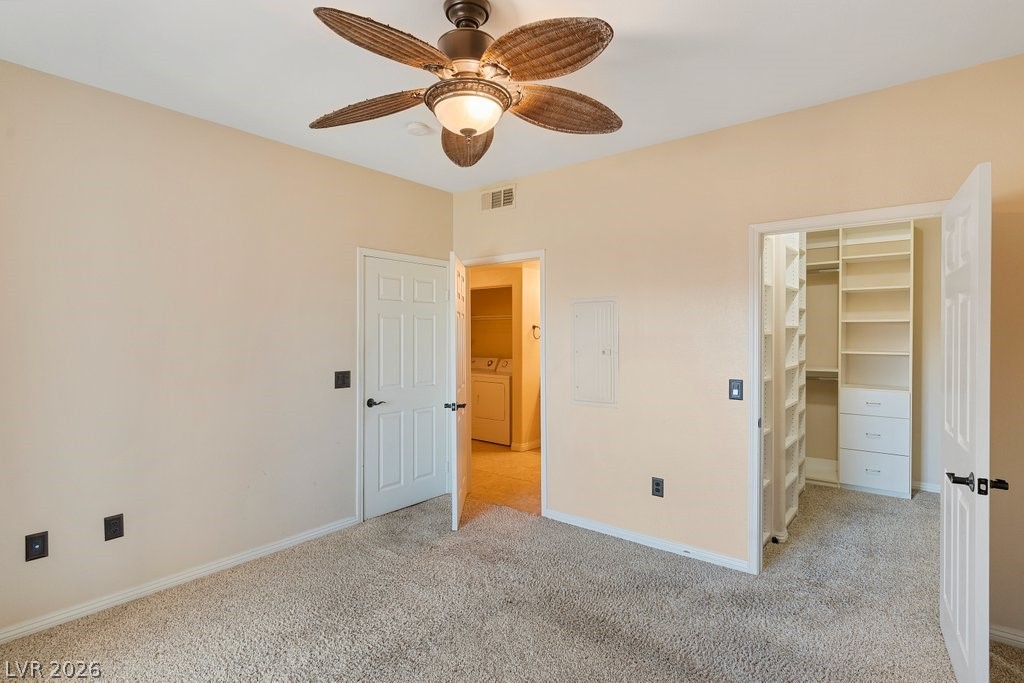 10001 Peace Way, Unit 2311 Las Vegas, NV 89147 - Photo 16 of 35 Unfurnished bedroom featuring a spacious closet, carpet floors, electric panel, and a ceiling fan
