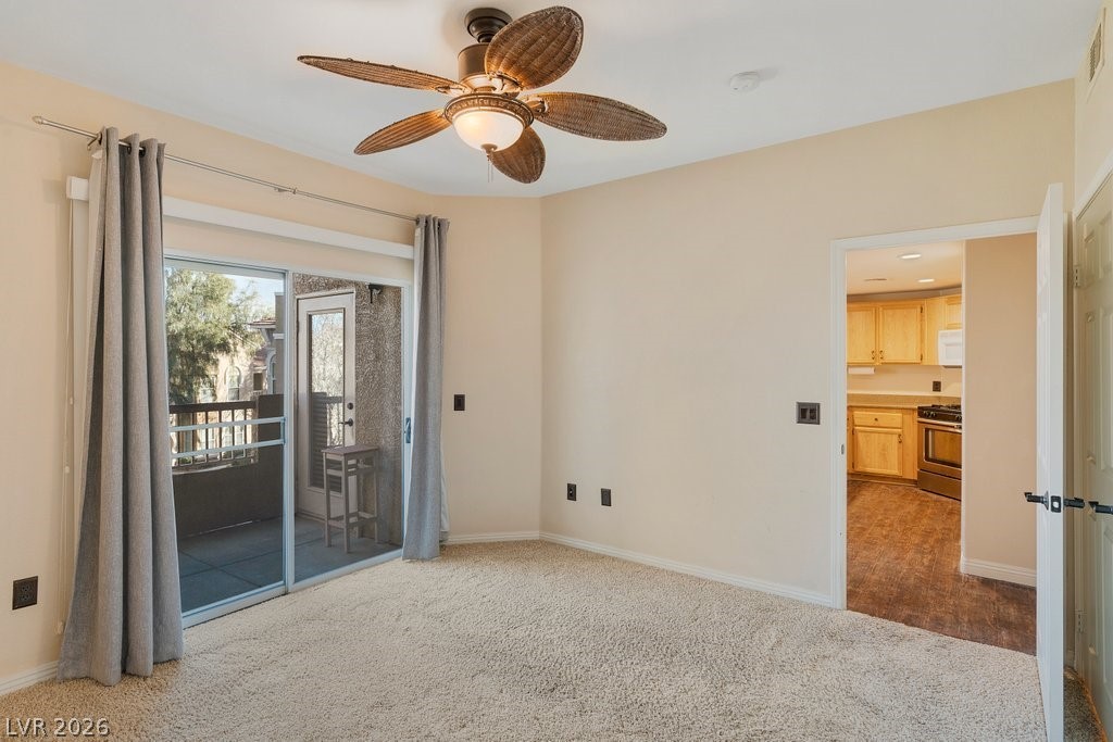 10001 Peace Way, Unit 2311 Las Vegas, NV 89147 - Photo 18 of 35 Empty room with carpet floors and ceiling fan