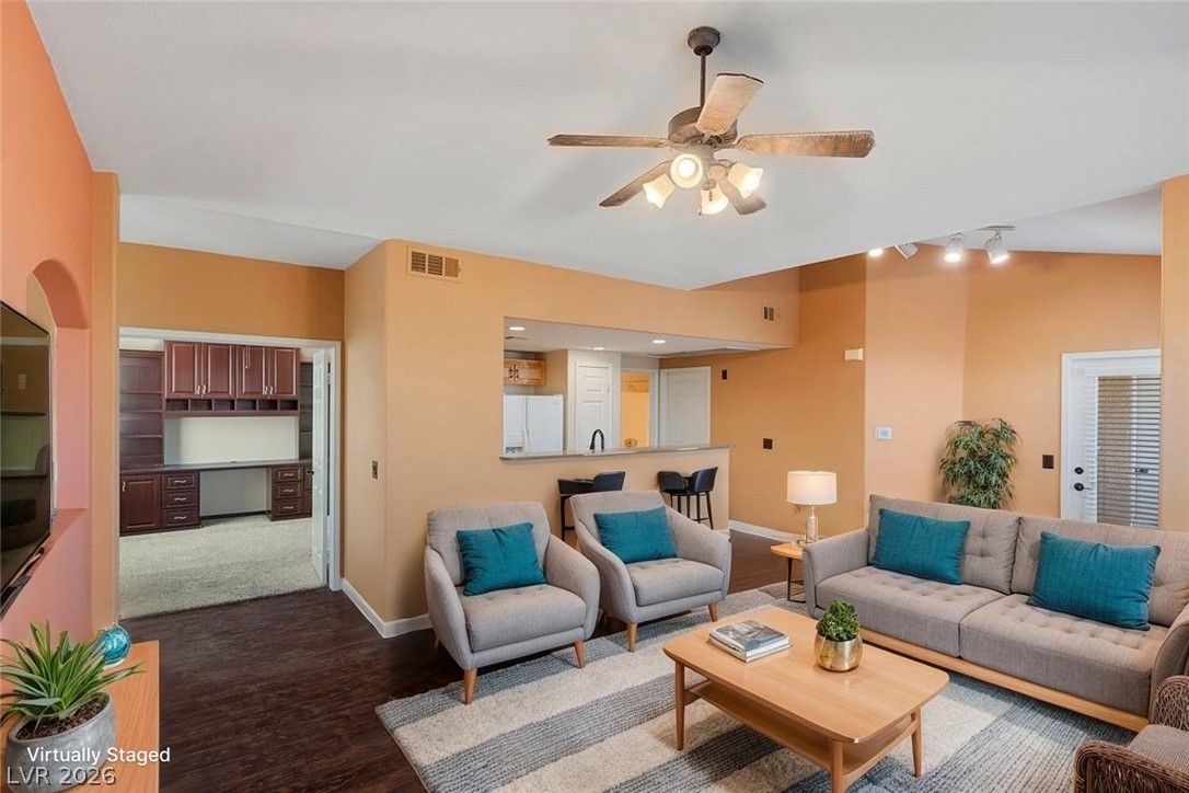 10001 Peace Way, Unit 2311 Las Vegas, NV 89147 - Photo 2 of 35 Living room with a ceiling fan and wood finished floors