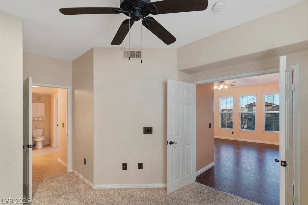 10001 Peace Way, Unit 2311 Las Vegas, NV 89147 - Photo 24 of 35 Unfurnished bedroom featuring carpet flooring and ceiling fan