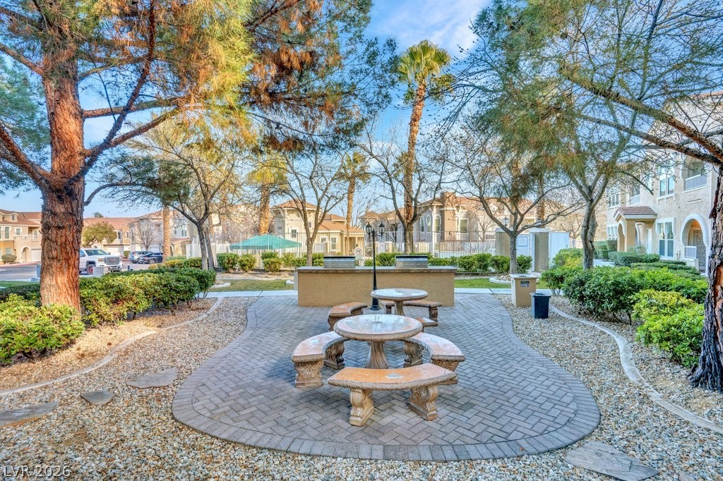 10001 Peace Way, Unit 2311 Las Vegas, NV 89147 - Photo 29 of 35 Surrounding community with a patio area, an outdoor kitchen / dining area, and a residential view