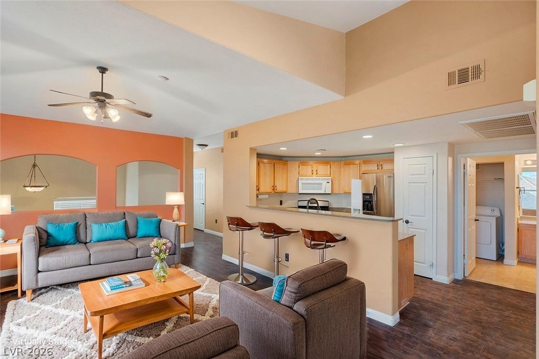 10001 Peace Way, Unit 2311 Las Vegas, NV 89147 - Photo 3 of 35 Living room featuring dark wood-style floors, washer / dryer, ceiling fan, and recessed lighting