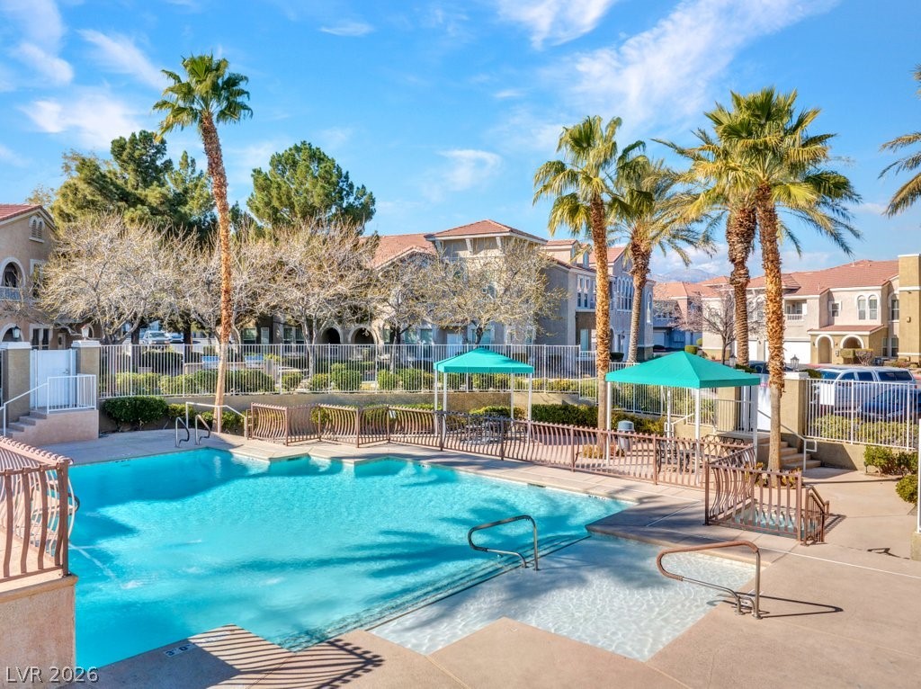 10001 Peace Way, Unit 2311 Las Vegas, NV 89147 - Photo 31 of 35 Community pool with a patio area